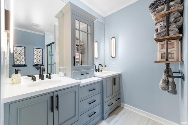 bathroom featuring ornamental molding and vanity