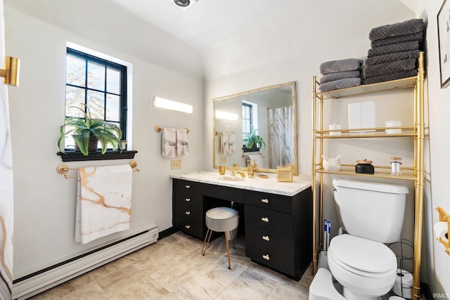 bathroom featuring vanity, a baseboard radiator, and toilet