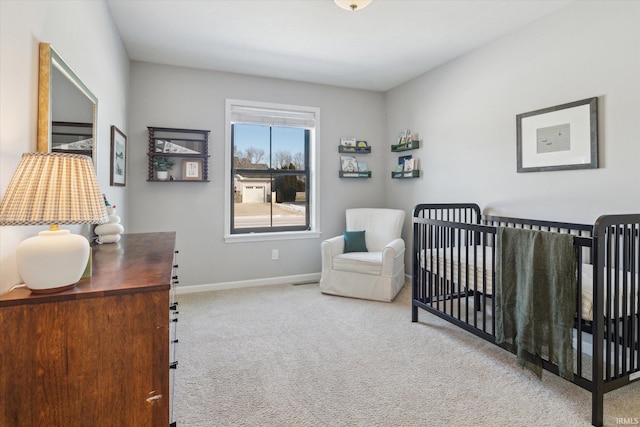 bedroom with carpet floors and a crib