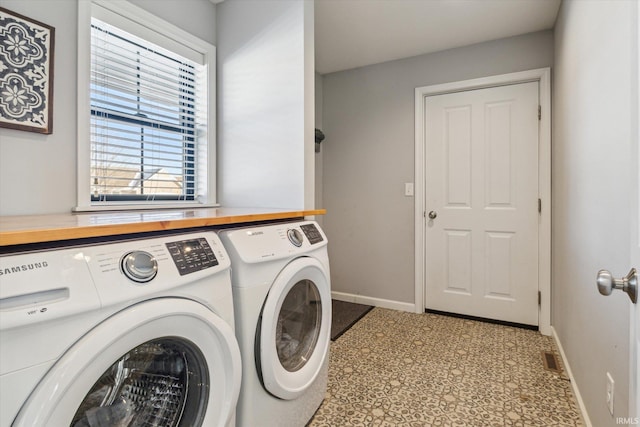 washroom with washer and clothes dryer