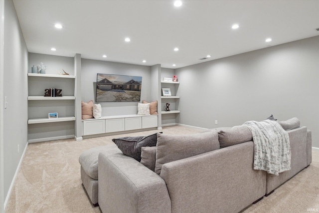 carpeted living room featuring built in shelves