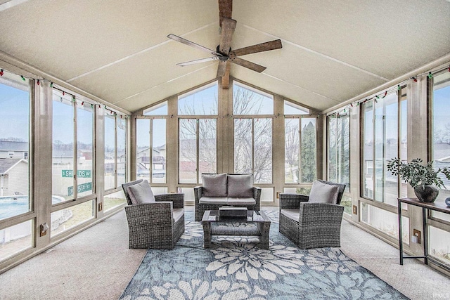 sunroom with lofted ceiling and ceiling fan