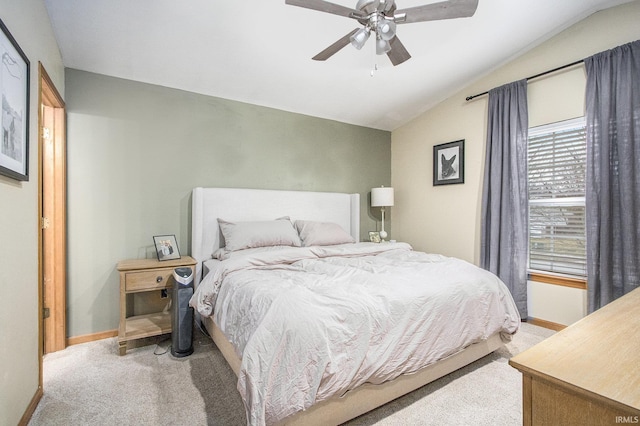 carpeted bedroom with lofted ceiling and ceiling fan