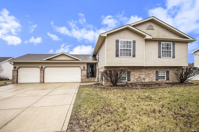 split level home with a garage and a front yard