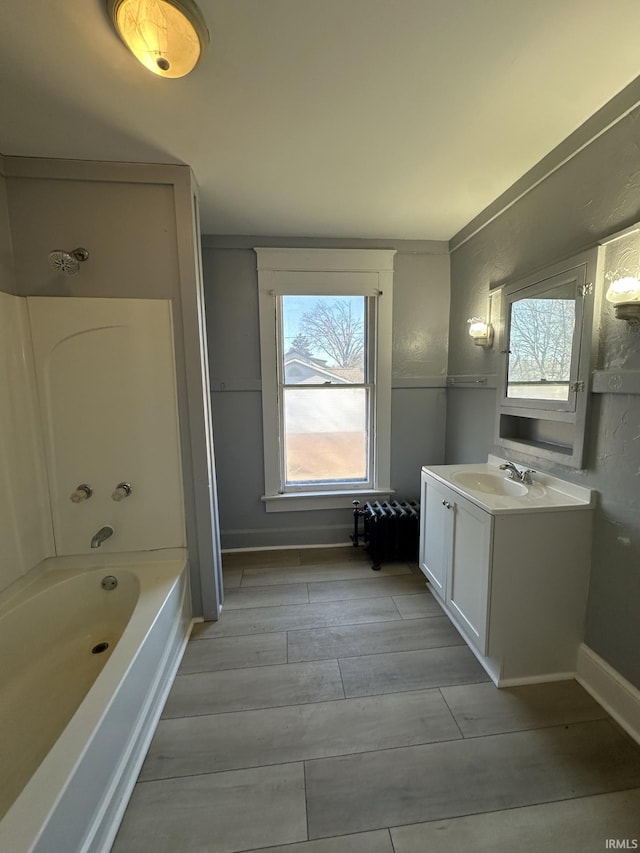 bathroom featuring vanity and shower / bath combination