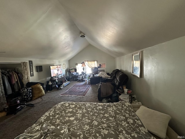 bedroom featuring lofted ceiling and carpet flooring