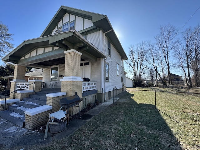 exterior space with a lawn and a porch