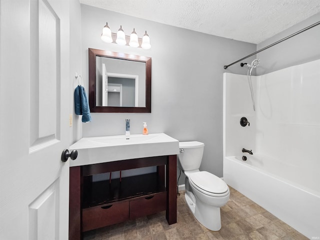 full bathroom with vanity, a textured ceiling, shower / bathtub combination, and toilet