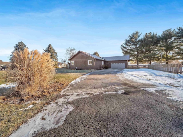 single story home featuring a garage