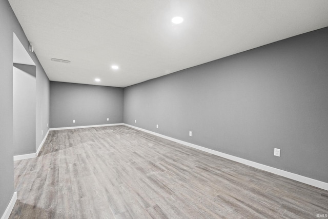 unfurnished room with light hardwood / wood-style floors