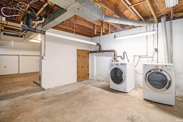 basement featuring washer and clothes dryer