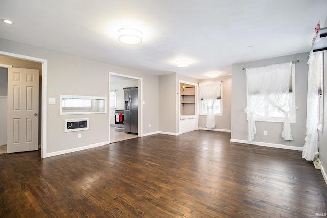 unfurnished living room featuring dark hardwood / wood-style flooring