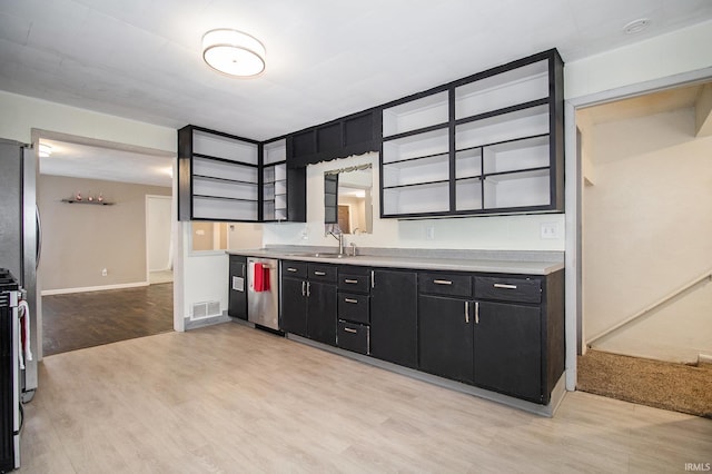 kitchen featuring sink, stainless steel appliances, and light wood-type flooring