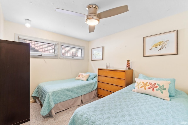 bedroom with ceiling fan and carpet