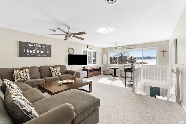 living room featuring carpet and ceiling fan