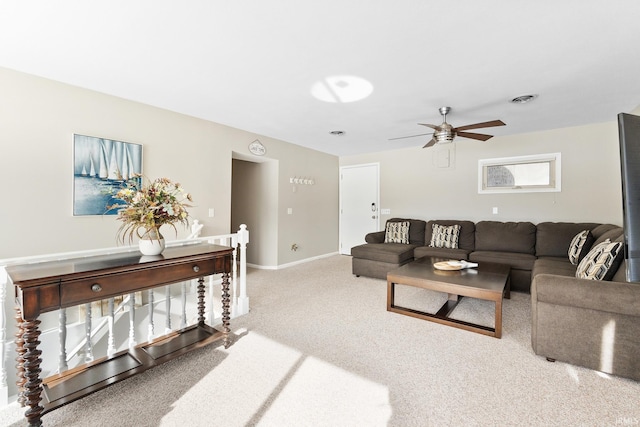 carpeted living room featuring ceiling fan