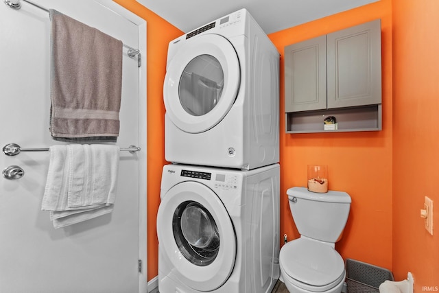 laundry room with stacked washer / drying machine