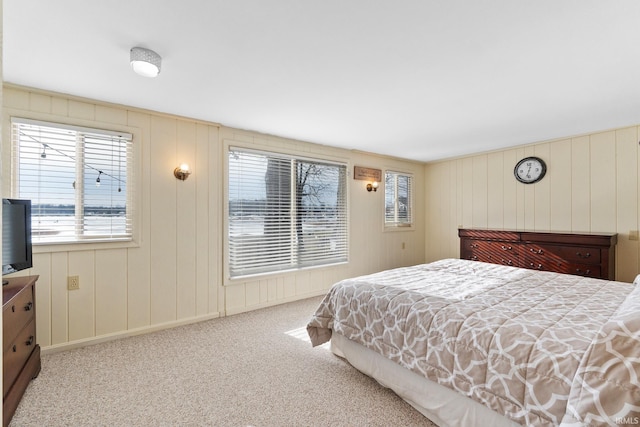 bedroom featuring light carpet