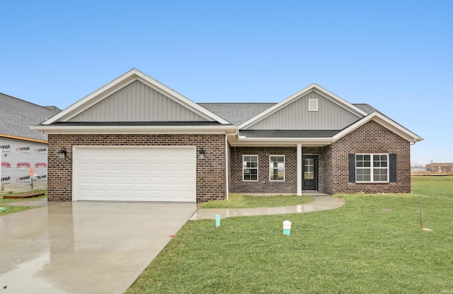 view of front of property featuring a garage and a front lawn