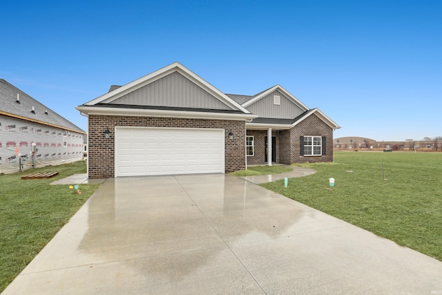 view of front of property featuring a garage and a front yard