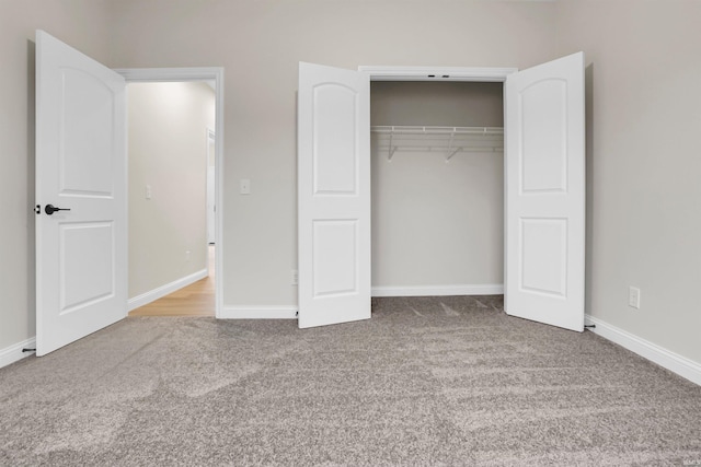 unfurnished bedroom featuring a closet and carpet