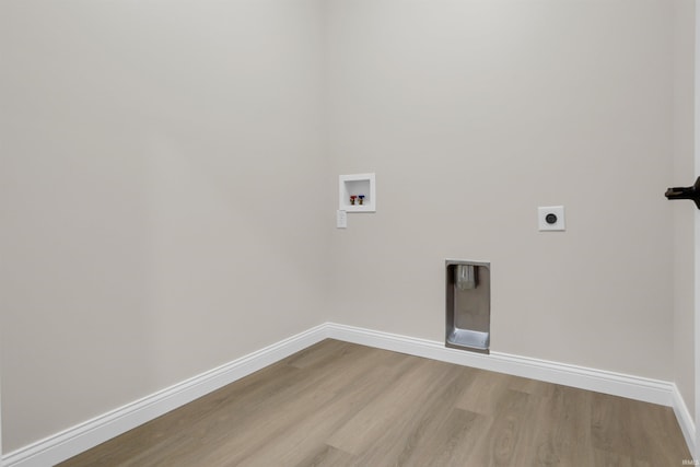 washroom with light wood-type flooring, hookup for a washing machine, and electric dryer hookup