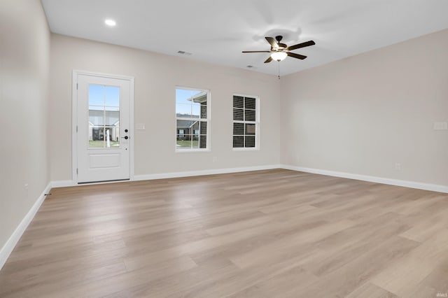 empty room featuring light hardwood / wood-style floors and ceiling fan