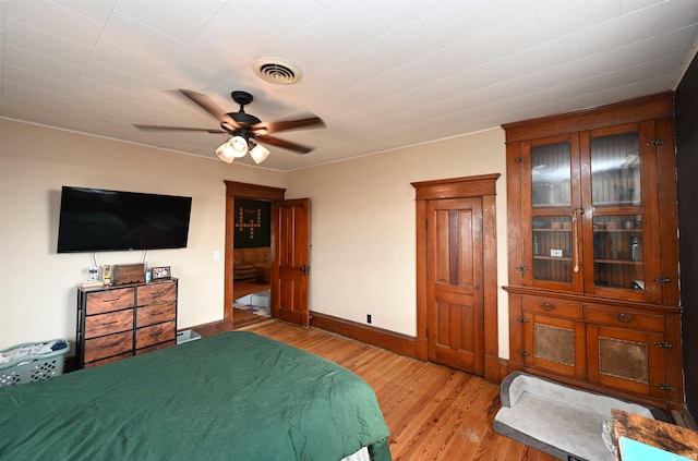 bedroom featuring ceiling fan and light wood-type flooring