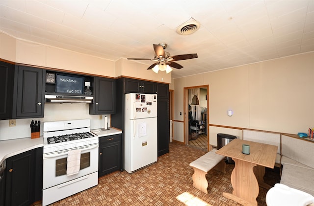 kitchen featuring ceiling fan and white appliances