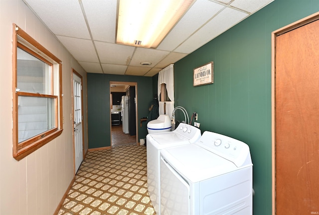 clothes washing area with washing machine and clothes dryer