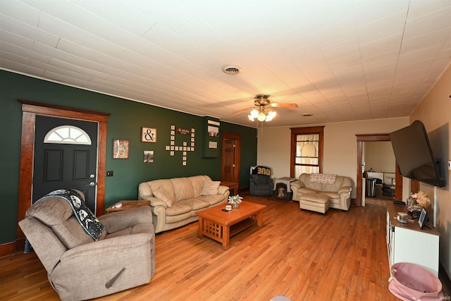 living room with ceiling fan and light wood-type flooring