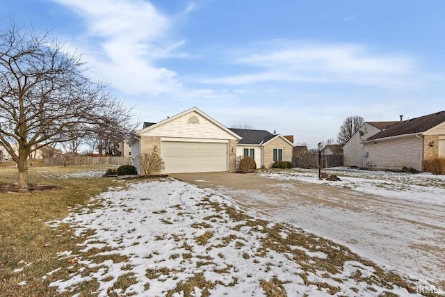 ranch-style home featuring a garage