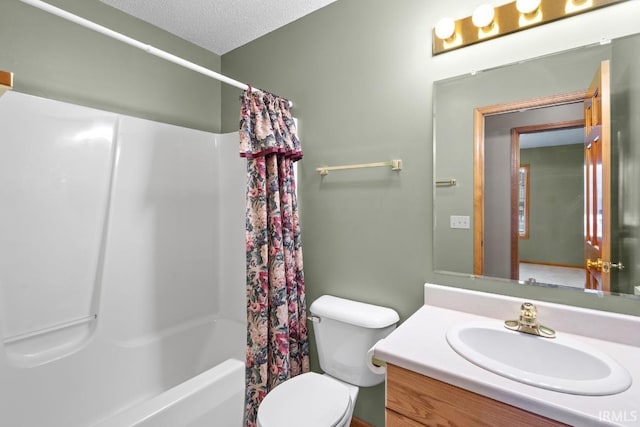 full bathroom with vanity, a textured ceiling, toilet, and shower / bath combo with shower curtain