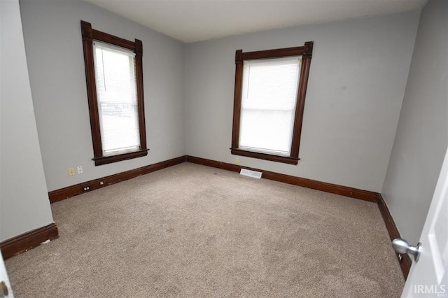 unfurnished room with carpet floors