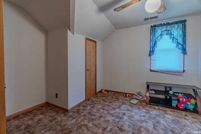 additional living space with ceiling fan, vaulted ceiling, and carpet