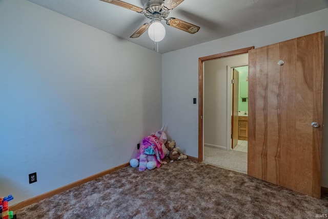 playroom featuring ceiling fan and carpet floors