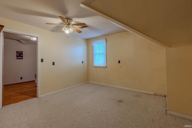 bonus room featuring light carpet and ceiling fan