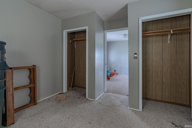 unfurnished bedroom with light colored carpet