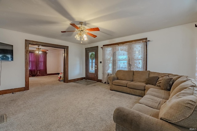 carpeted living room featuring ceiling fan