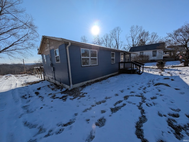 view of snow covered property