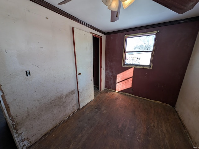 corridor with crown molding and dark wood-type flooring