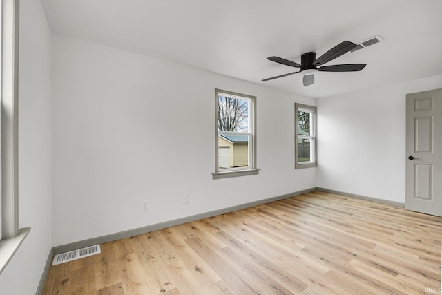 empty room with light hardwood / wood-style floors and ceiling fan