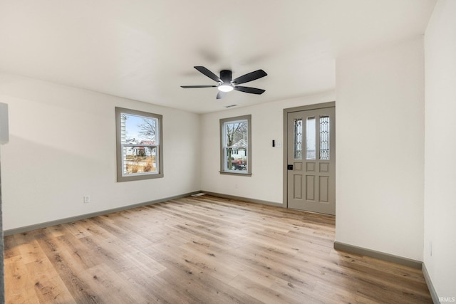 unfurnished room featuring ceiling fan and light hardwood / wood-style floors