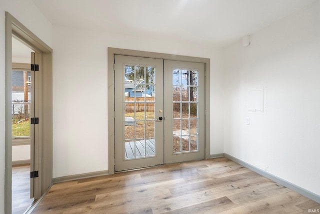 doorway to outside featuring french doors, plenty of natural light, and light hardwood / wood-style floors