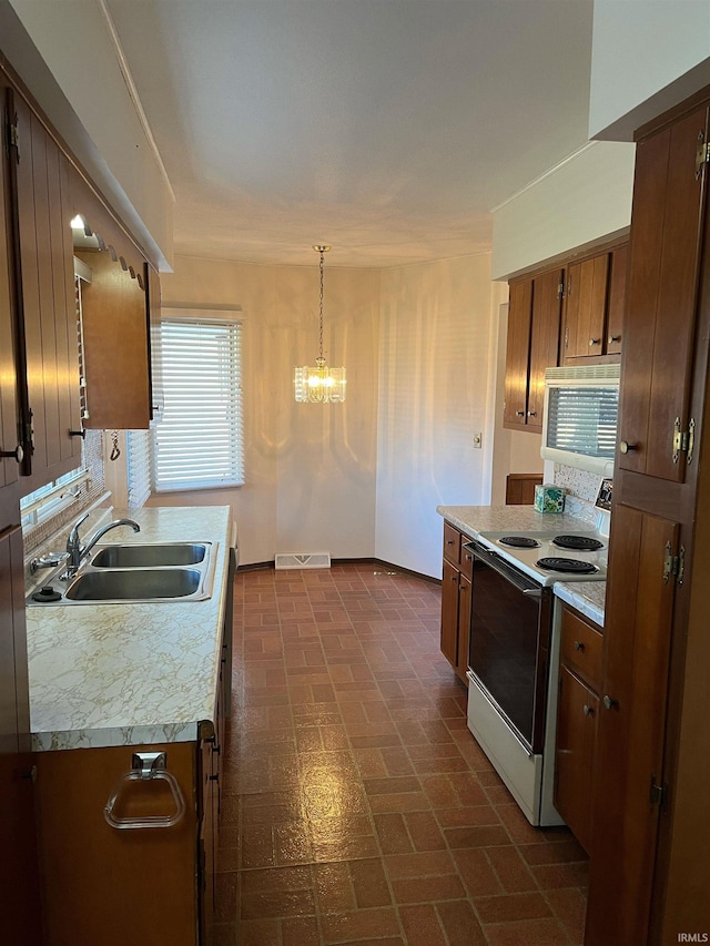 kitchen featuring decorative light fixtures, tasteful backsplash, sink, white range with electric cooktop, and an inviting chandelier