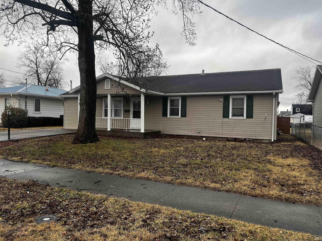 single story home with a porch