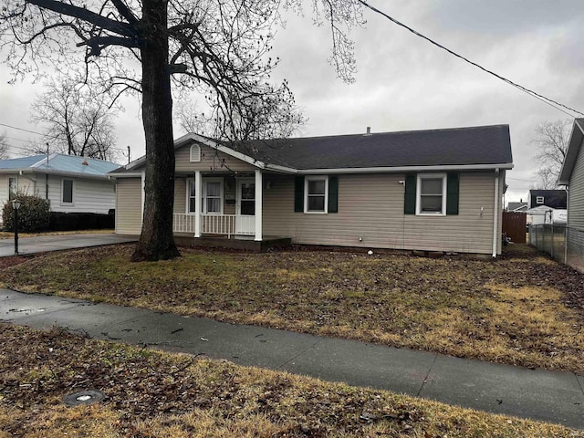 single story home with a porch