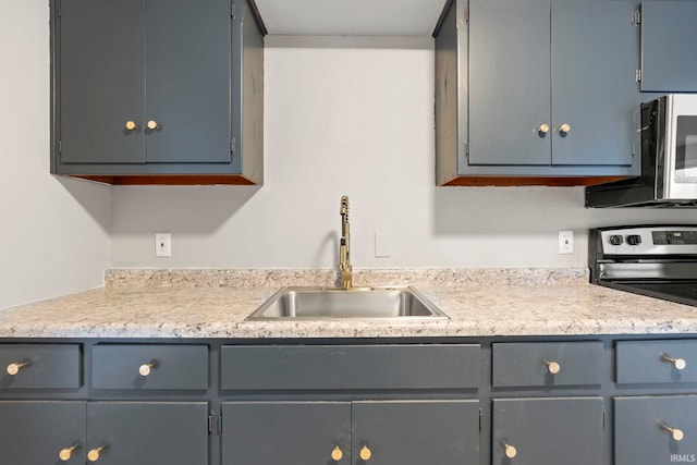 kitchen featuring appliances with stainless steel finishes and sink