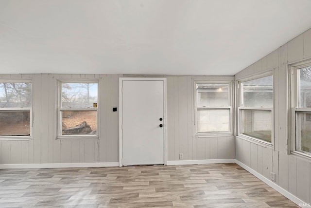 foyer featuring plenty of natural light and light hardwood / wood-style floors