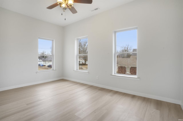 unfurnished room with ceiling fan and light hardwood / wood-style floors